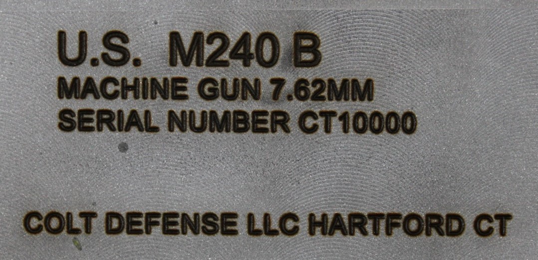 Image depicts required information engraved on an M240 B to be in compliance with federal guidelines.